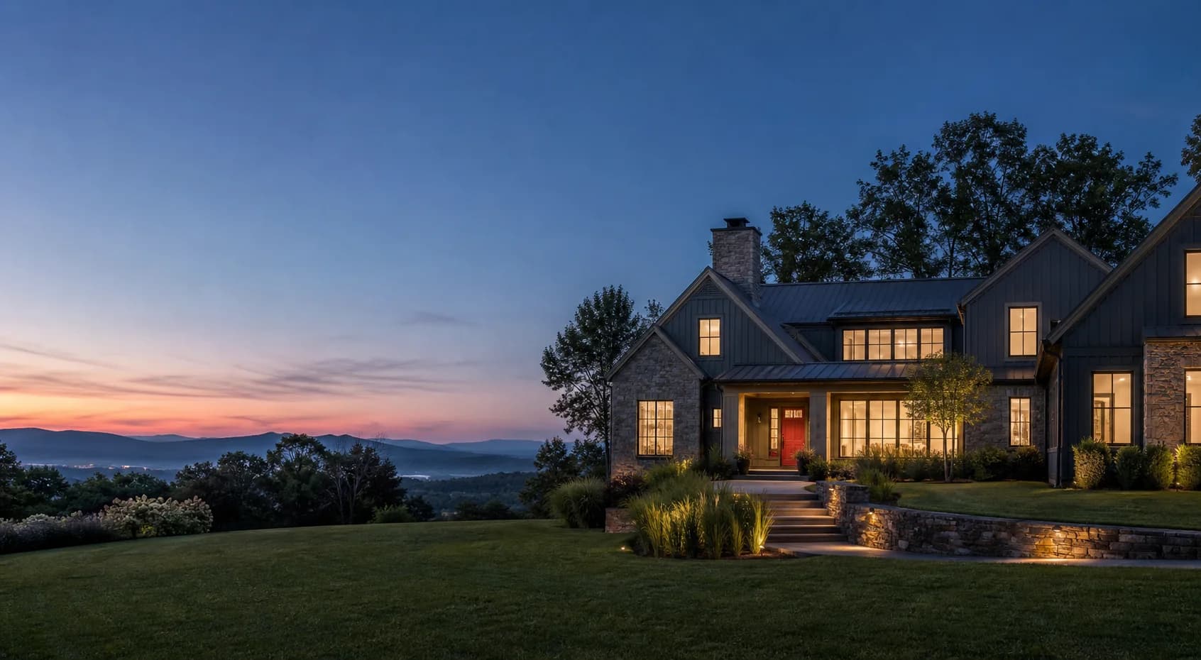 Hudson Valley residence overlooking wooded ridgelines at dusk